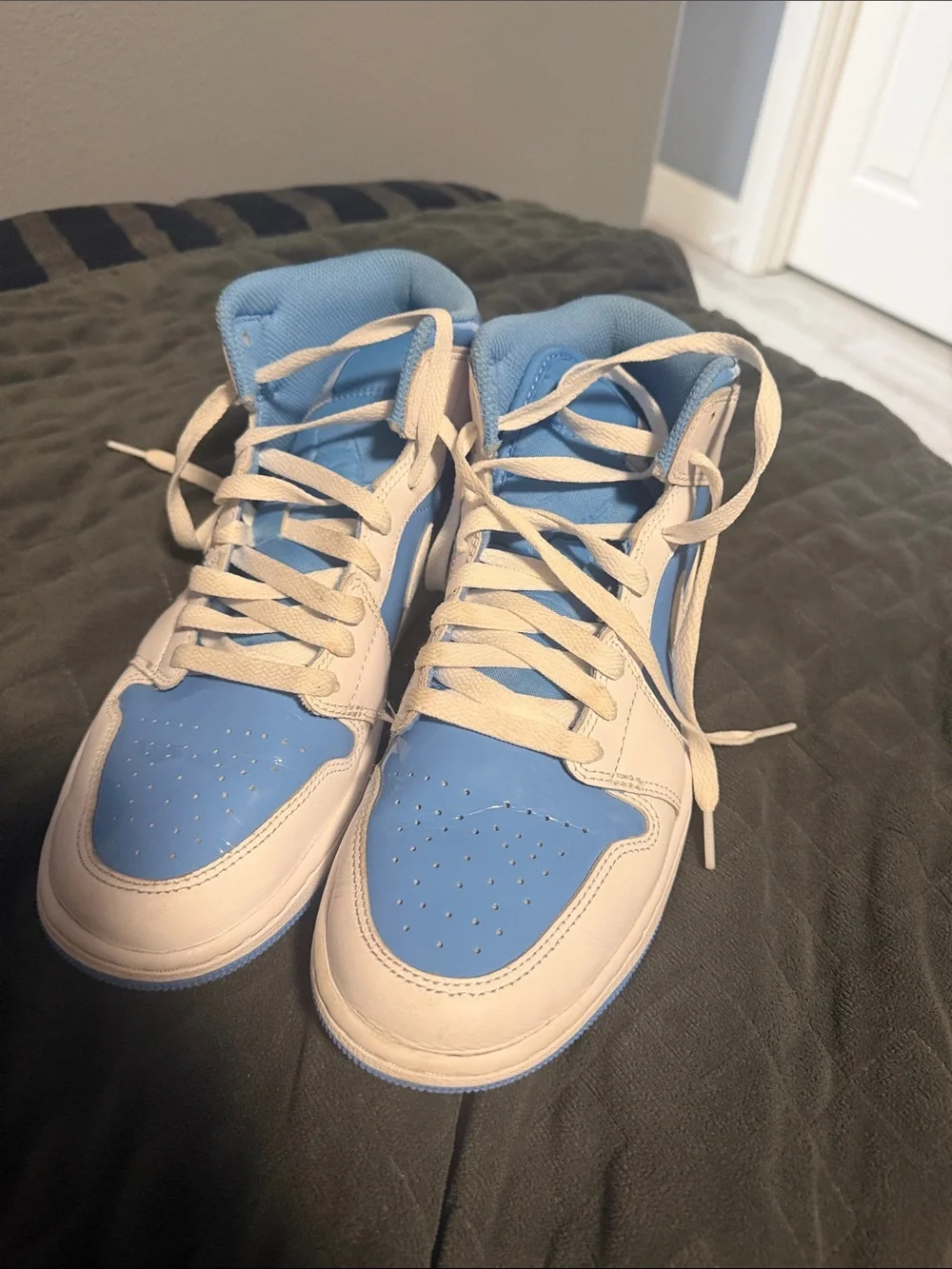 8 men’s Air Jordan UNC color way mid tops